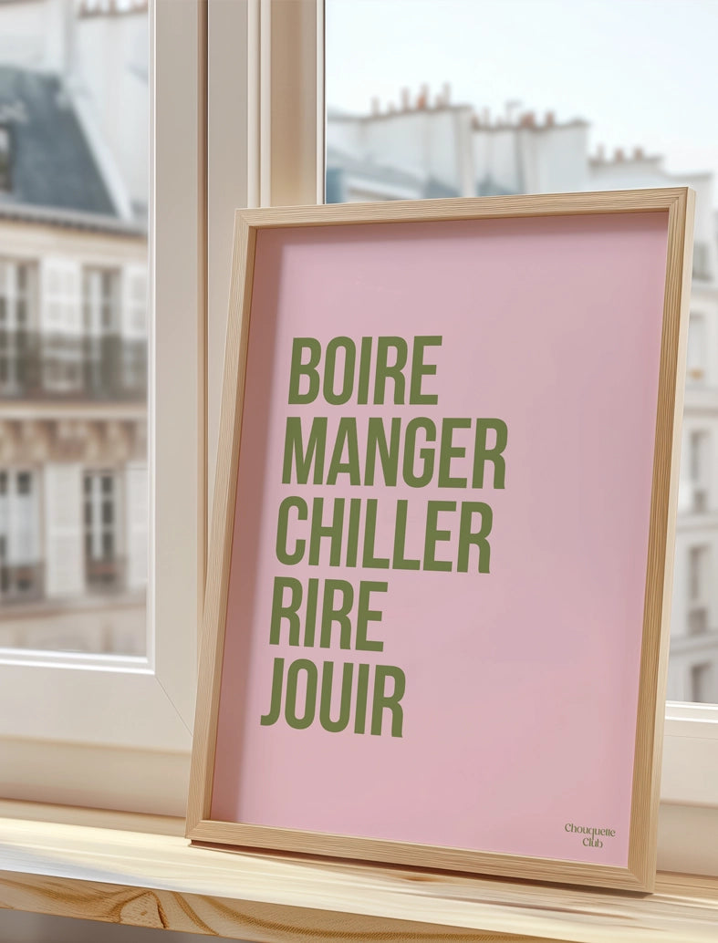 Boire manger chiller rire jouir rose et kaki affiche A3 posée sur un rebord de fenêtre