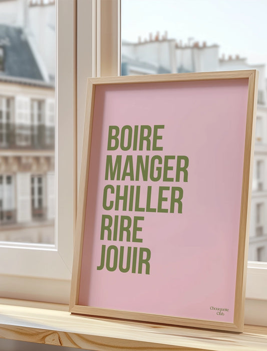 Boire manger chiller rire jouir rose et kaki affiche A3 posée sur un rebord de fenêtre